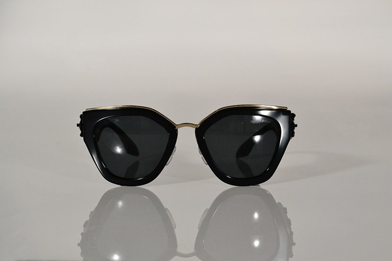 Sunglasses: Black and gold with beaded arms, R8 790, Prada at Sunglass Hut
