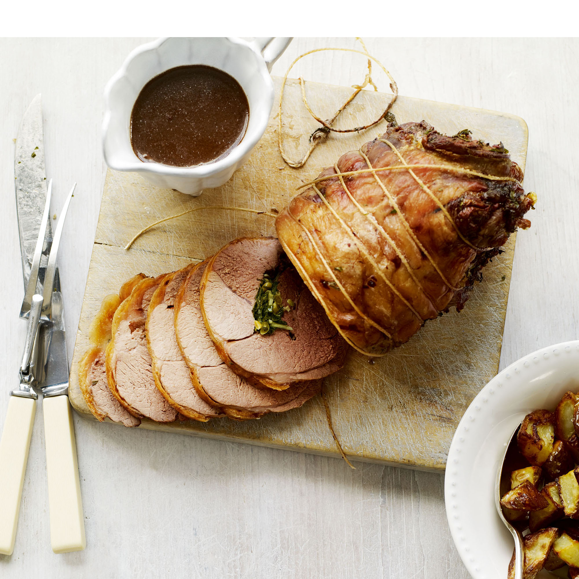 Boned leg of spring lamb with herb and pine nut stuffing recipe