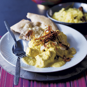 Creamy chicken curry with fried onions and flaked almonds recipe