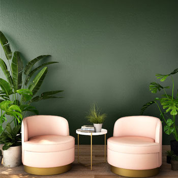coral chairs against green wall