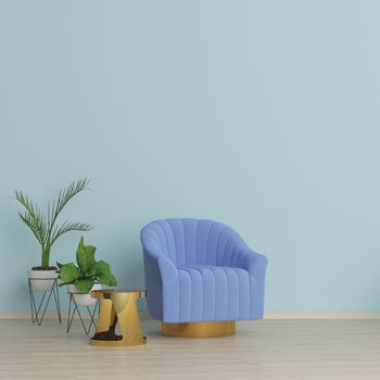 blue chair against mint wall