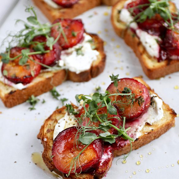toasted brioche with orange, thyme, baked plums and whipped goats' cheese