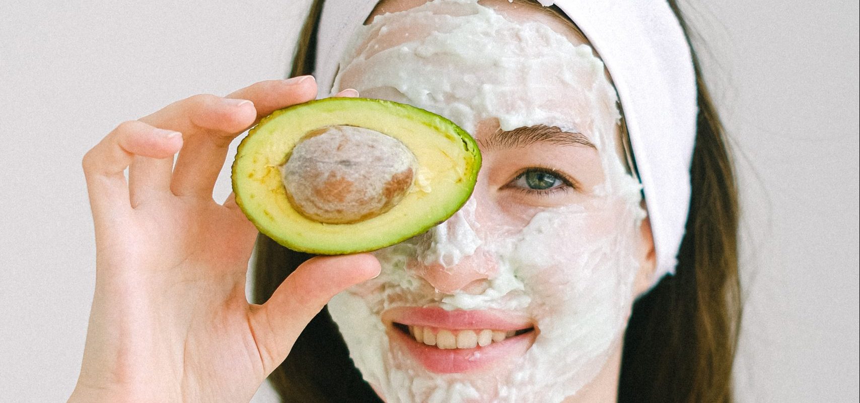 clean beauty woman with avocado facemask