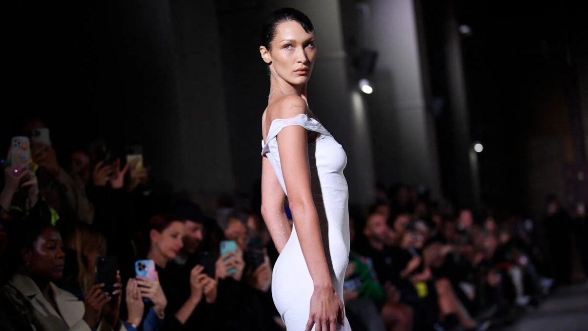 Bella Hadid has a white dress sprayed-on at Coperni show