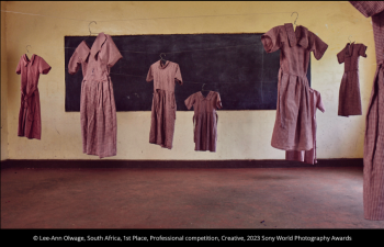 a photo of school dresses hanging in a classroom