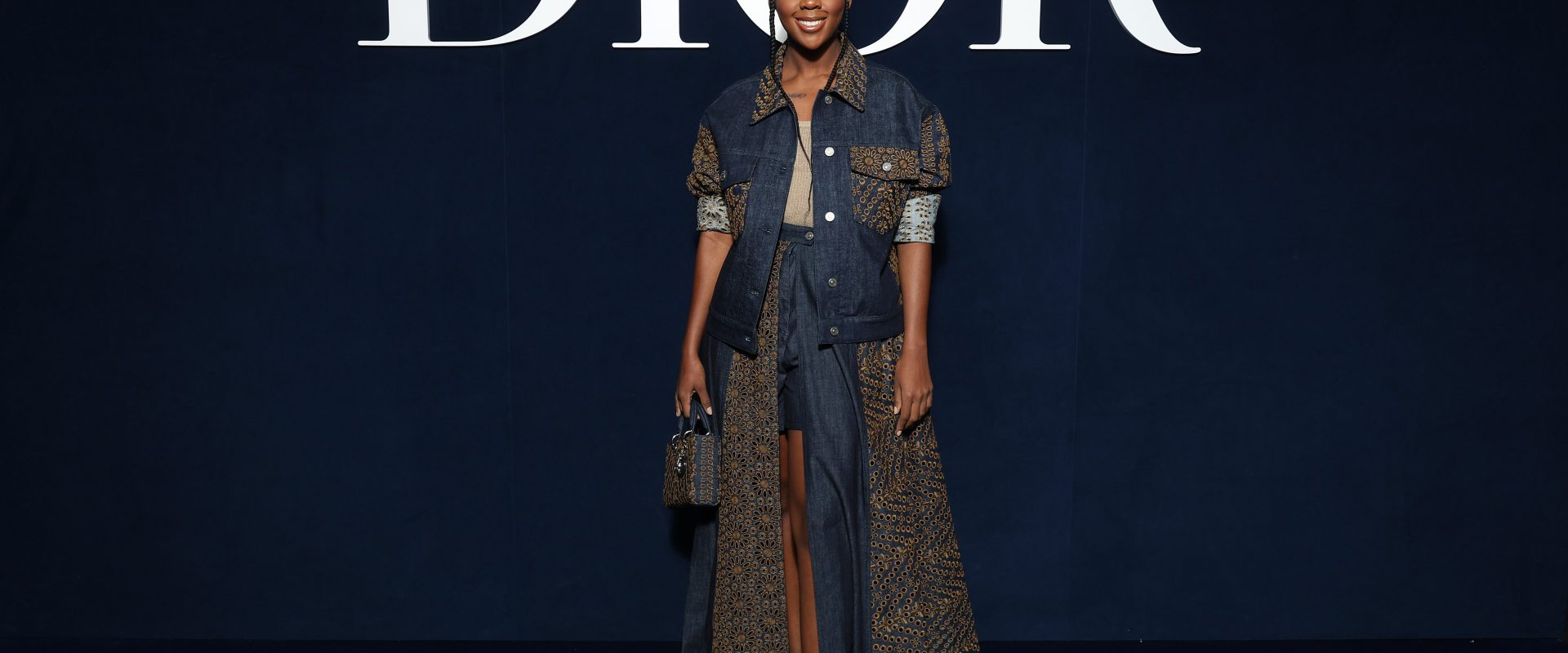 Thuso Mbedu in front of the Dior sign