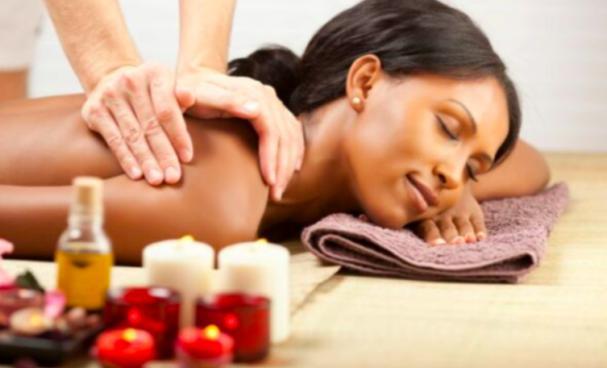 a woman relaxing while getting a massage