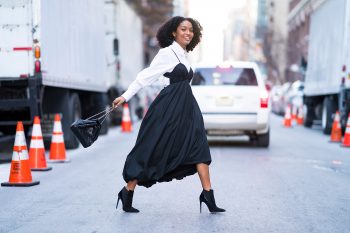 yara shahidi in a dress with a blouse layered underneath