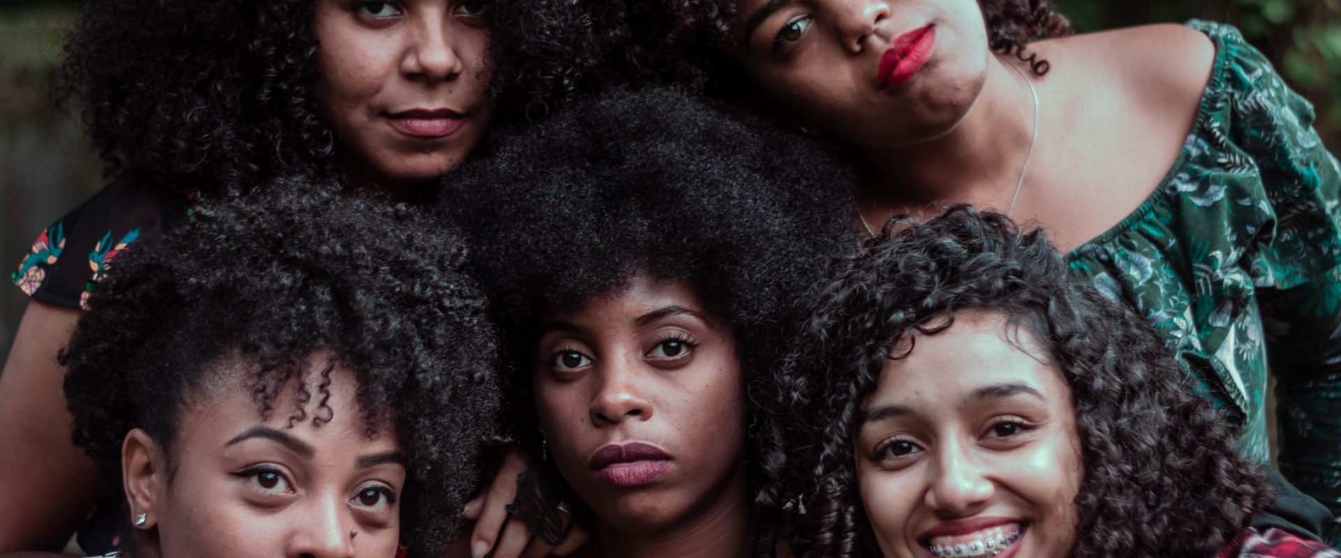 a group of women with natural hair