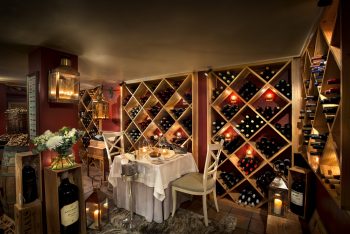 a dinner setup in a wine cellar