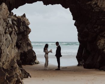 a couple eloping on a beach