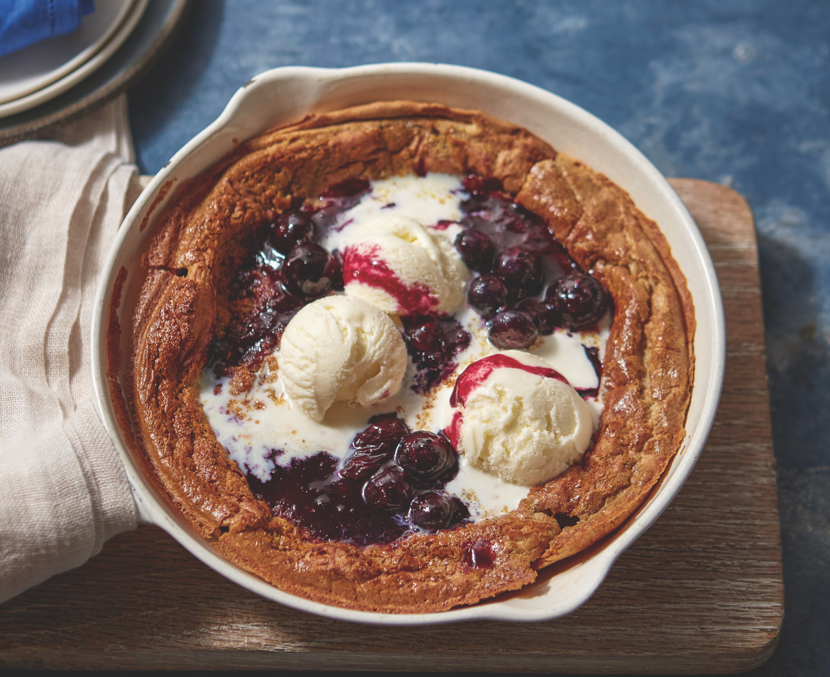 Gluten free Dutch baby pancake with blueberry compote and ice cream
