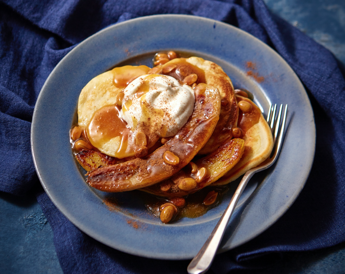 Scotch pancakes with banana, maple butterscotch and peanut sauce