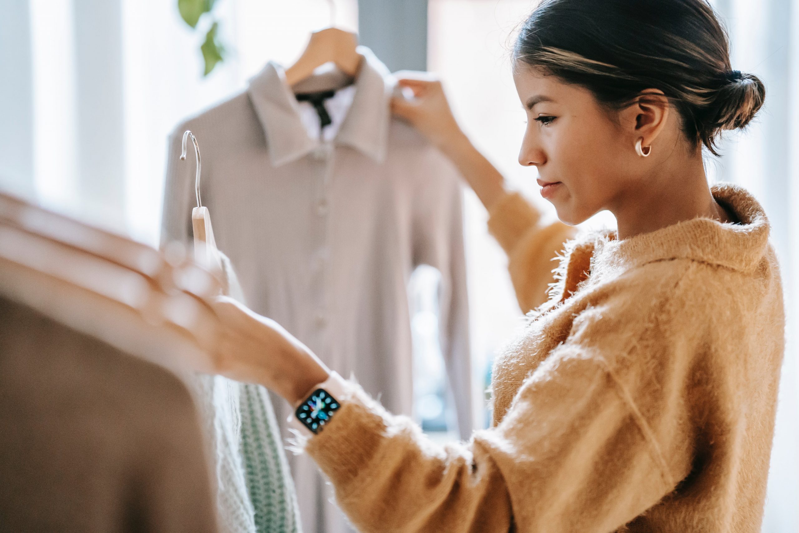 Woman looking at clothes based on colour theory