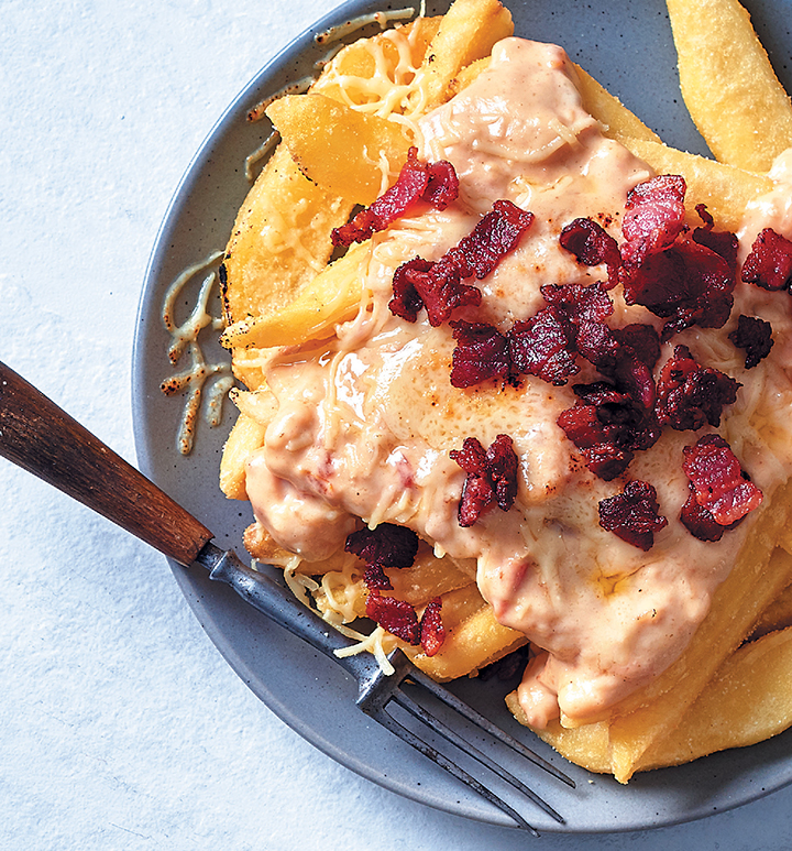 Loaded fries with cheese sauce and crispy bacon