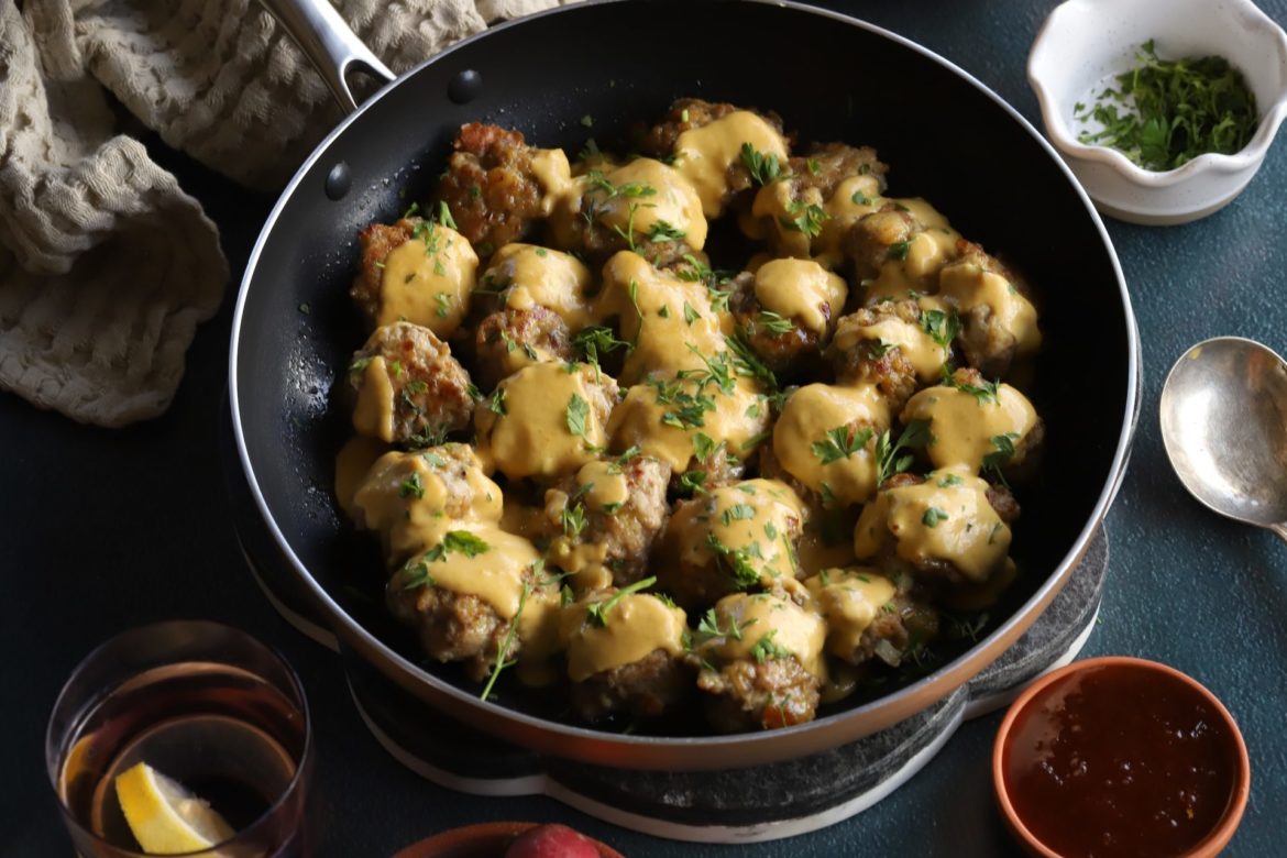 Spiced pork meatballs with crispy pap balls and onion gravy